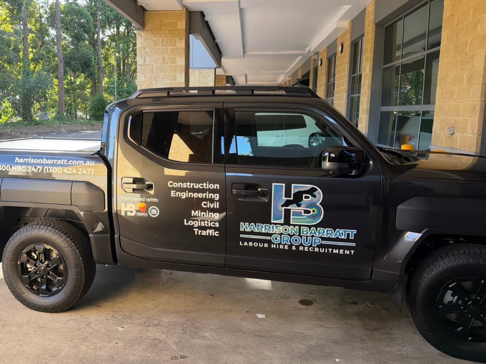 A Harrison Barratt Group branded ute at the office